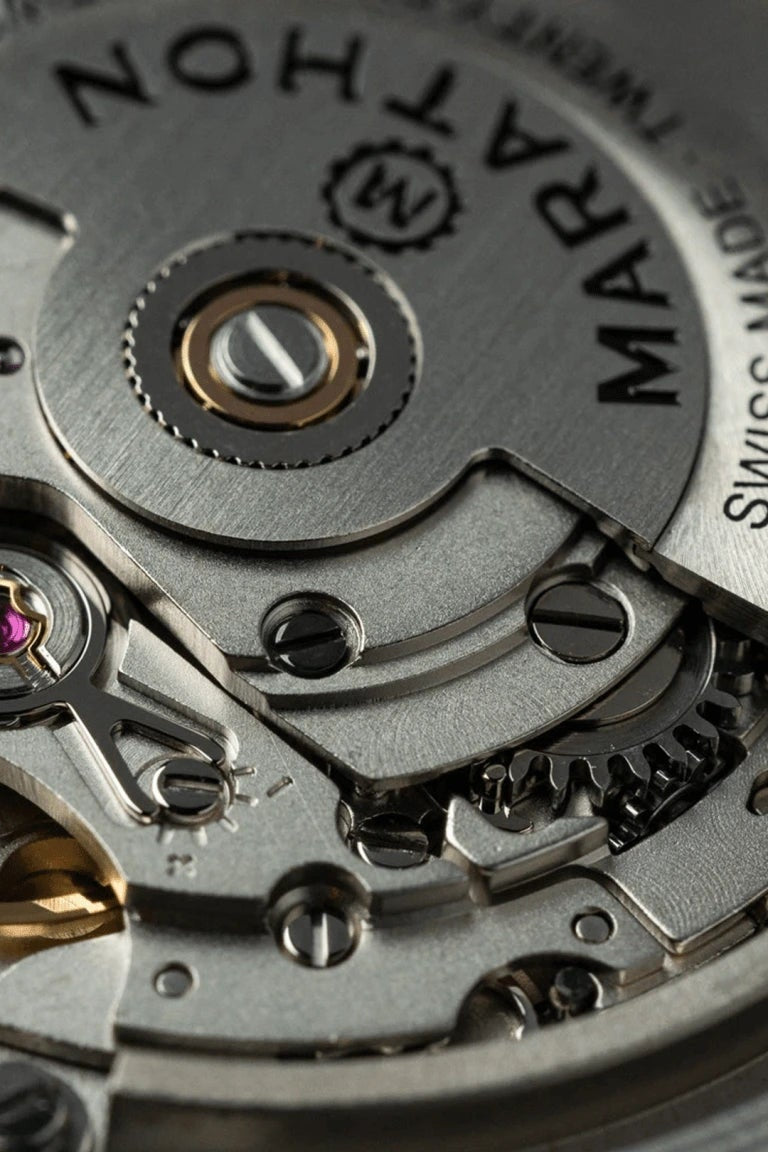 Close-up of a watch mechanism with 'Maration' branding
